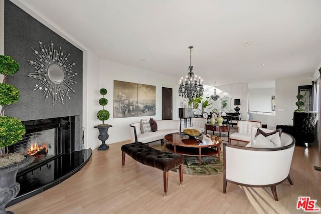 living room featuring light hardwood / wood-style floors and a fireplace