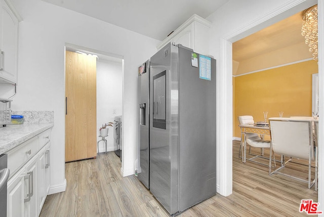 corridor featuring light hardwood / wood-style floors