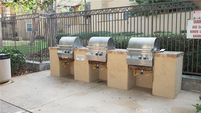 view of patio with an outdoor kitchen and area for grilling