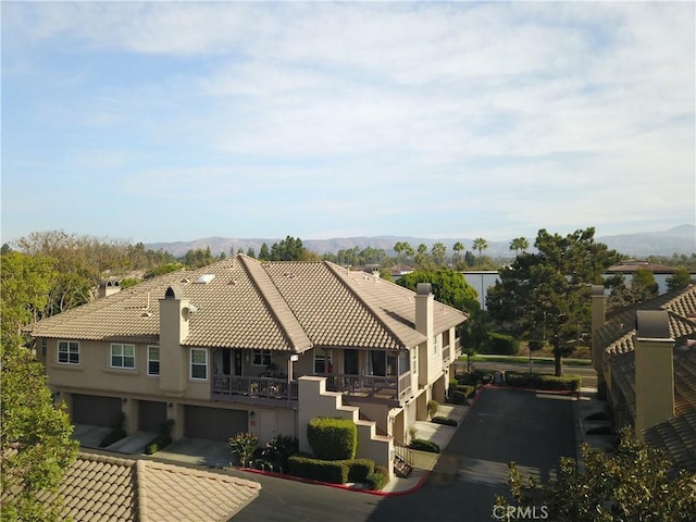 birds eye view of property featuring a mountain view