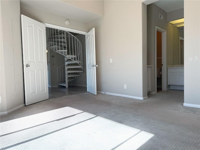 unfurnished bedroom with carpet floors