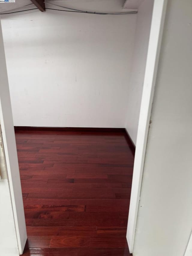 unfurnished room featuring dark hardwood / wood-style flooring