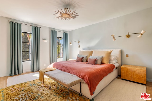 bedroom with light hardwood / wood-style floors