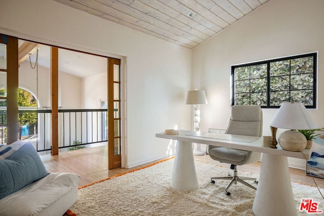 office with wooden ceiling, lofted ceiling, and light wood-type flooring