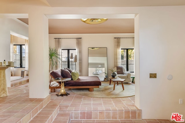 sitting room featuring ornamental molding