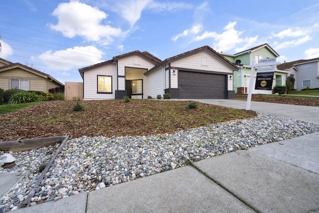 ranch-style home with a garage