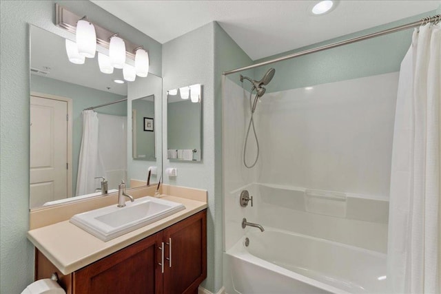 bathroom with vanity and shower / bath combo with shower curtain