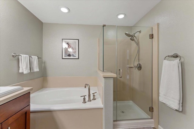 bathroom with vanity and plus walk in shower