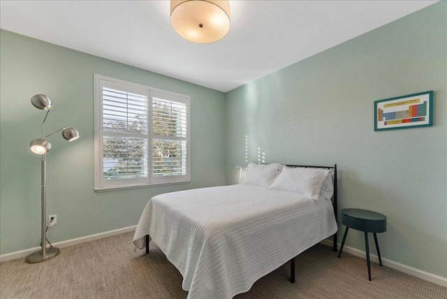 bedroom with light colored carpet