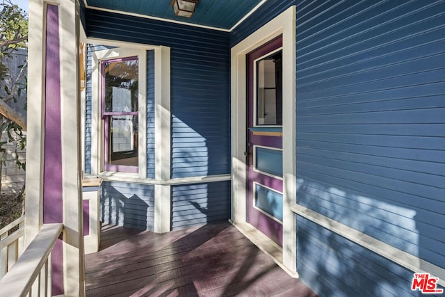 view of side of home with covered porch