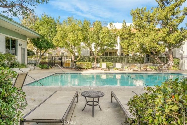 view of swimming pool featuring a patio