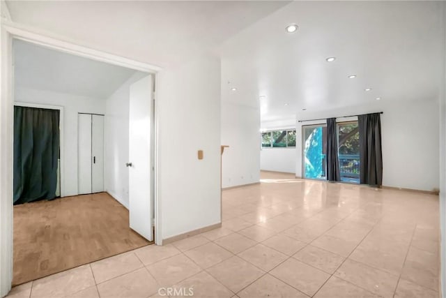 unfurnished room featuring light tile patterned floors