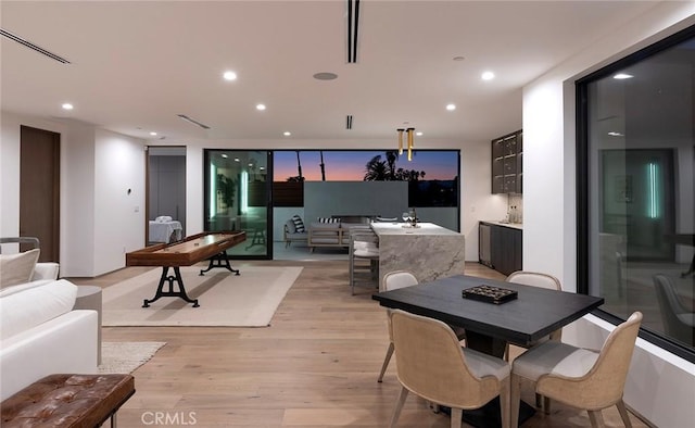 dining room with light hardwood / wood-style floors