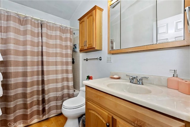 full bathroom with toilet, vanity, shower / bath combination with curtain, and hardwood / wood-style floors