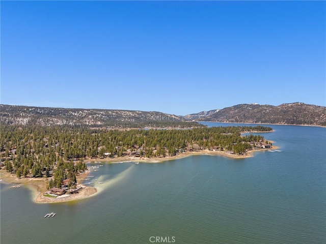 aerial view featuring a water and mountain view