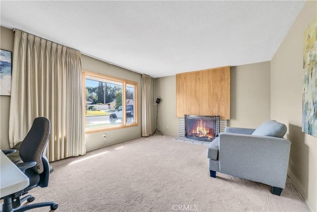 interior space featuring light colored carpet and a brick fireplace