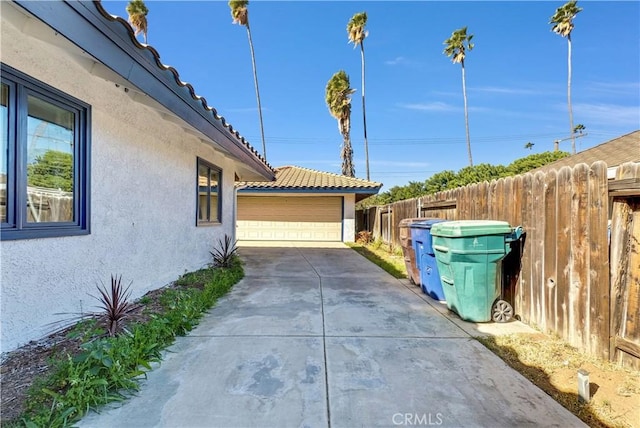 view of side of home with a garage