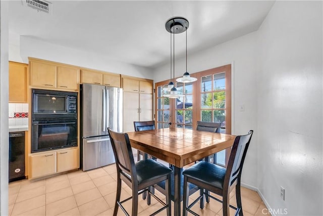 dining area featuring light tile patterned floors