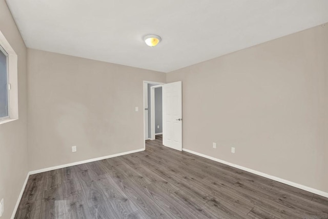 unfurnished room featuring wood-type flooring