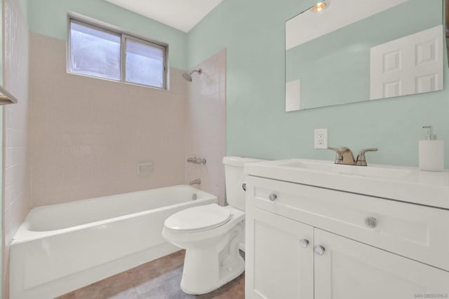 full bathroom featuring toilet, tiled shower / bath, and vanity