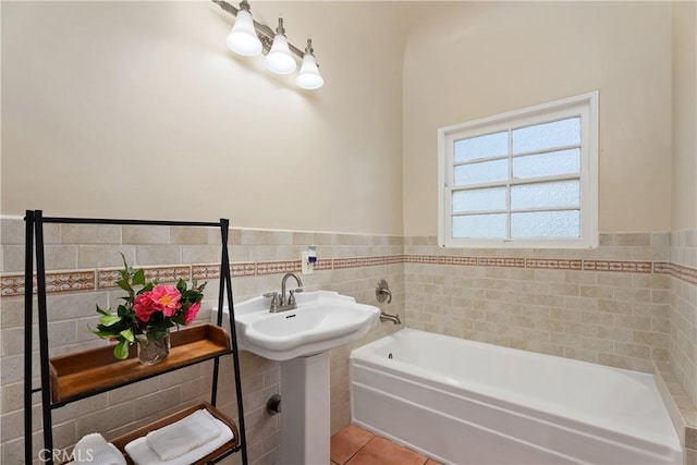 4485 Myrtle Ave, Long Beach, CA 90807 - full bath with tile patterned flooring, wainscoting, tile walls, and a bath