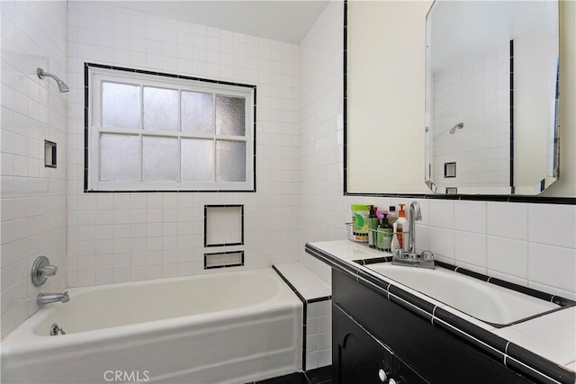4485 Myrtle Ave, Long Beach, CA 90807 - full bathroom featuring tasteful backsplash, shower / bath combination, tile walls, and vanity