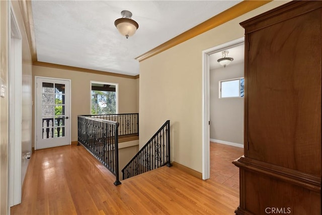 4485 Myrtle Ave, Long Beach, CA 90807 - hallway with a healthy amount of sunlight, light wood-type flooring, and an upstairs landing