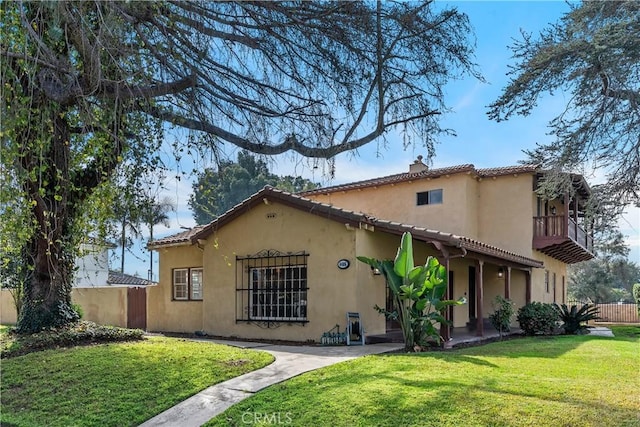 4485 Myrtle Ave, Long Beach, CA 90807 - rear view of house featuring stucco siding, fence, and a yard