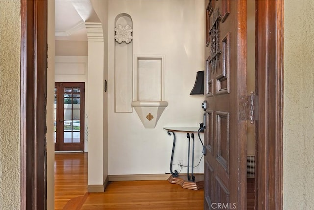 4485 Myrtle Ave, Long Beach, CA 90807 - hallway featuring light wood-type flooring, baseboards, and crown molding
