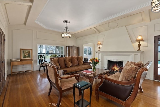 4485 Myrtle Ave, Long Beach, CA 90807 - living room featuring a fireplace, ornamental molding, a decorative wall, and wood finished floors