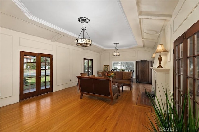 4485 Myrtle Ave, Long Beach, CA 90807 - living area featuring ornamental molding, french doors, light wood-style floors, and a decorative wall