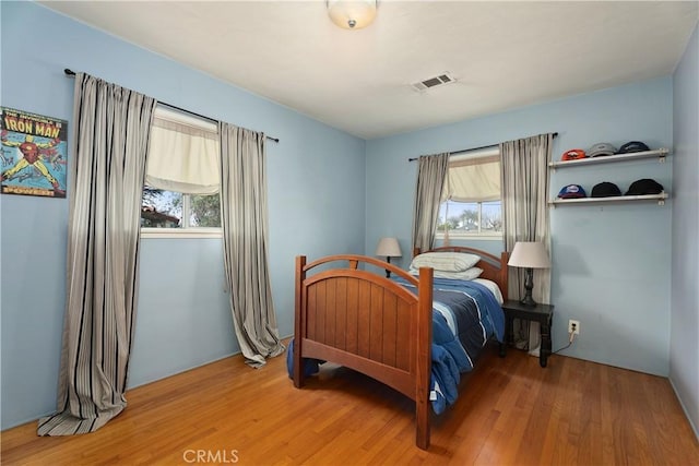 4485 Myrtle Ave, Long Beach, CA 90807 - bedroom featuring wood finished floors and visible vents