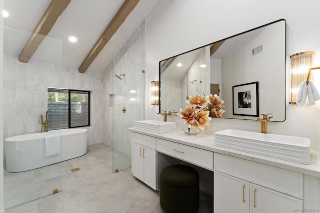 bathroom featuring tile walls, a tub, vaulted ceiling with beams, and vanity