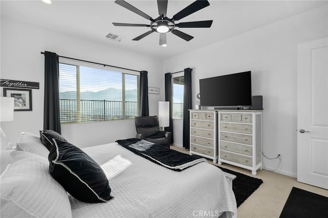 carpeted bedroom with ceiling fan