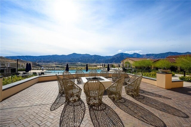 view of patio / terrace with a mountain view