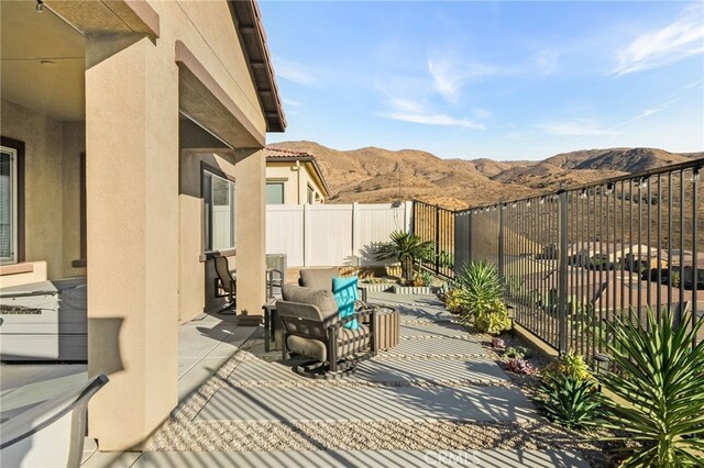 view of patio / terrace featuring a mountain view