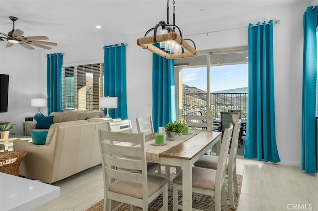 dining room with ceiling fan and plenty of natural light