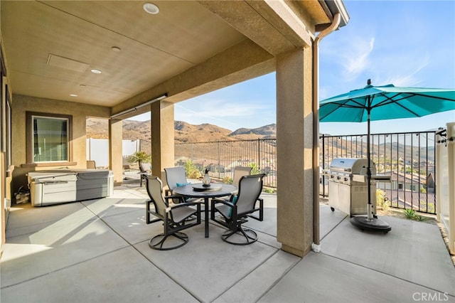 view of patio featuring a mountain view and area for grilling