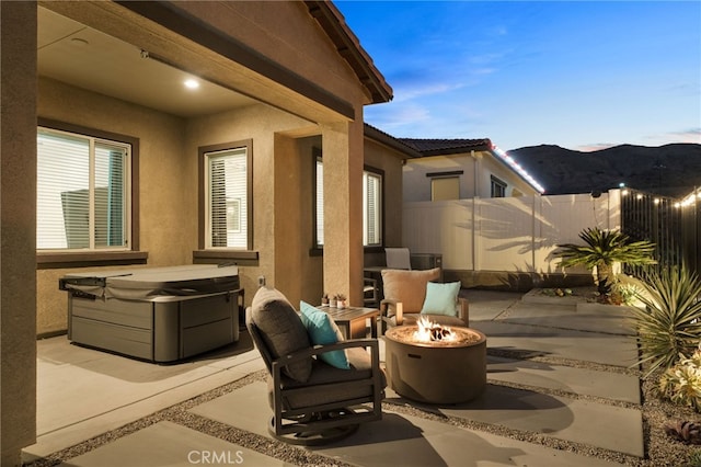 patio terrace at dusk with an outdoor fire pit