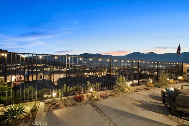 patio terrace at dusk with a mountain view