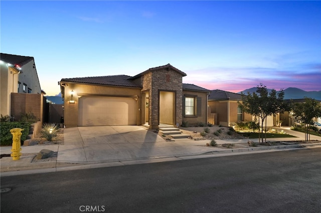 view of front of property with a garage