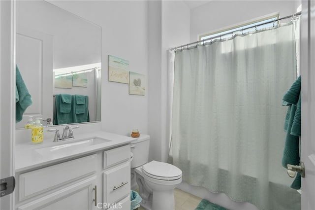 full bathroom featuring toilet, vanity, and shower / bathtub combination with curtain