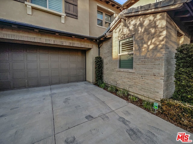 view of side of property featuring a garage