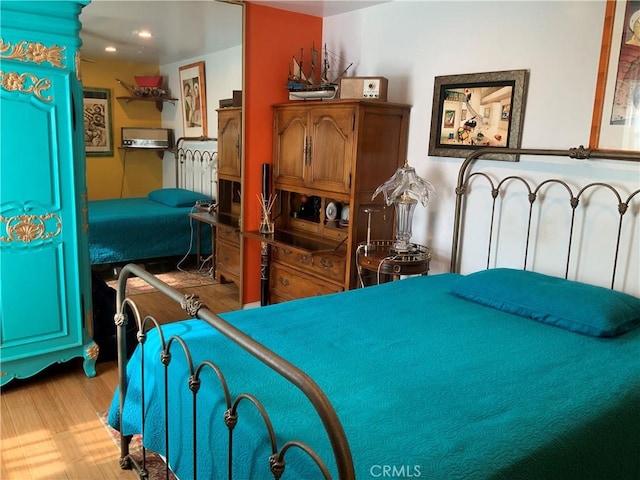 bedroom with light hardwood / wood-style floors