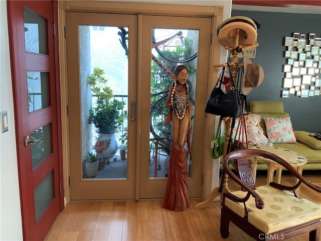 entryway featuring french doors and light hardwood / wood-style floors