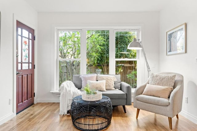 sitting room with light hardwood / wood-style floors