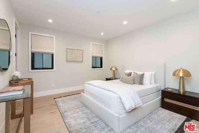 bedroom with light hardwood / wood-style flooring