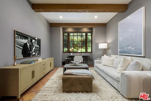 living room featuring beam ceiling and light tile patterned flooring