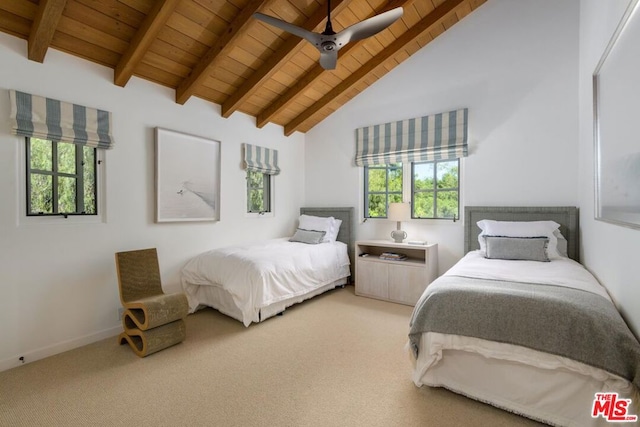 carpeted bedroom with ceiling fan, wood ceiling, and vaulted ceiling with beams