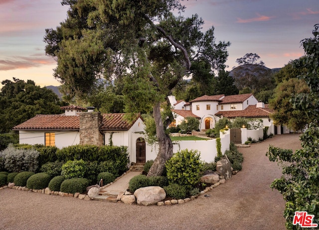 mediterranean / spanish-style home with a mountain view